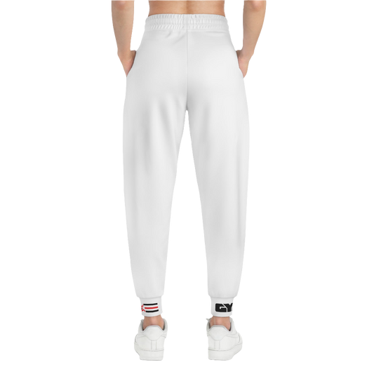 A person standing frontal, wearing silver gray joggers Gymstar with a logoand white sneakers. The joggers have a ribbed bottom and waistband cuffs, and feature two side pockets.