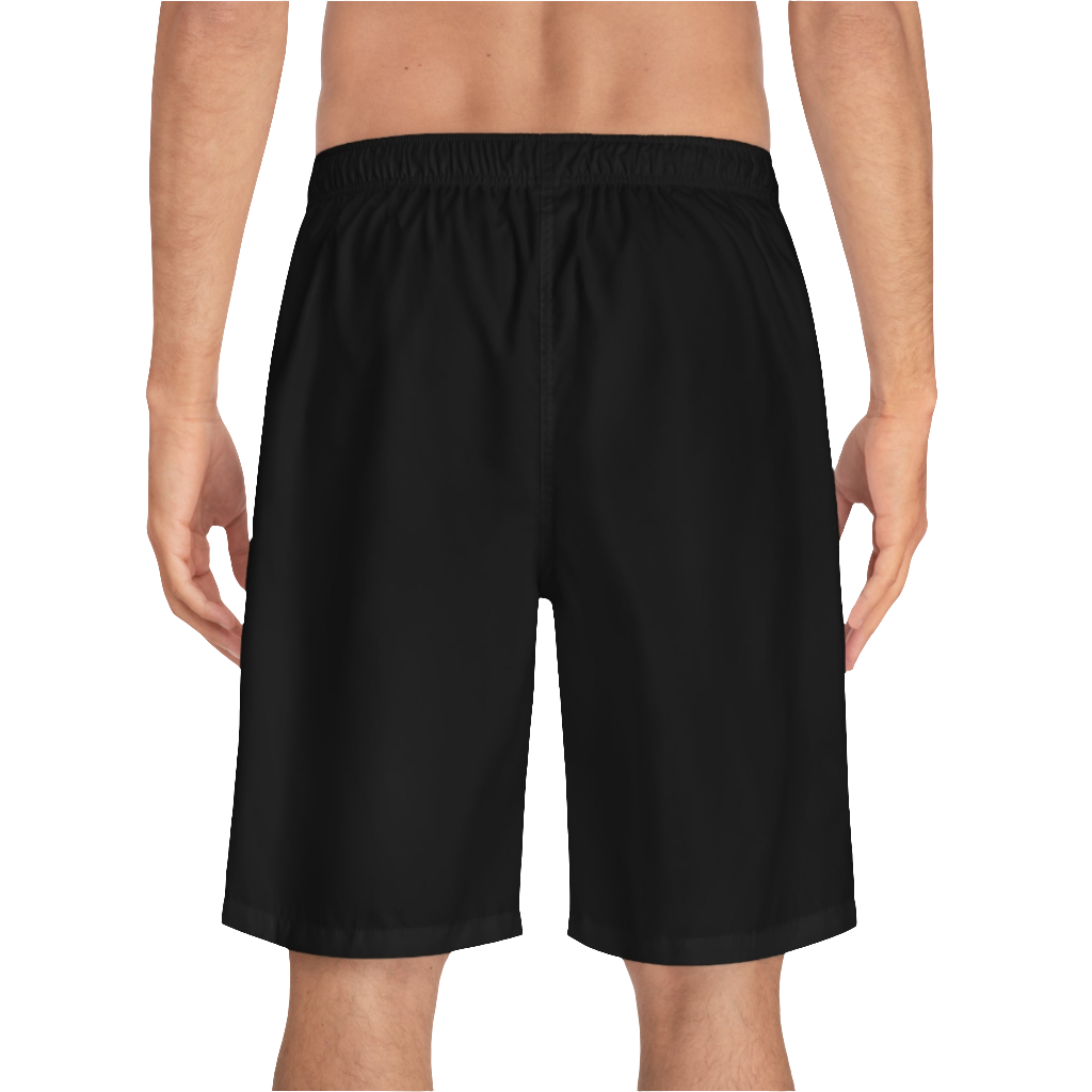 A man wearing black sports shorts with an elastic waistband and drawstrings, featuring a logo on the left leg  back side view.