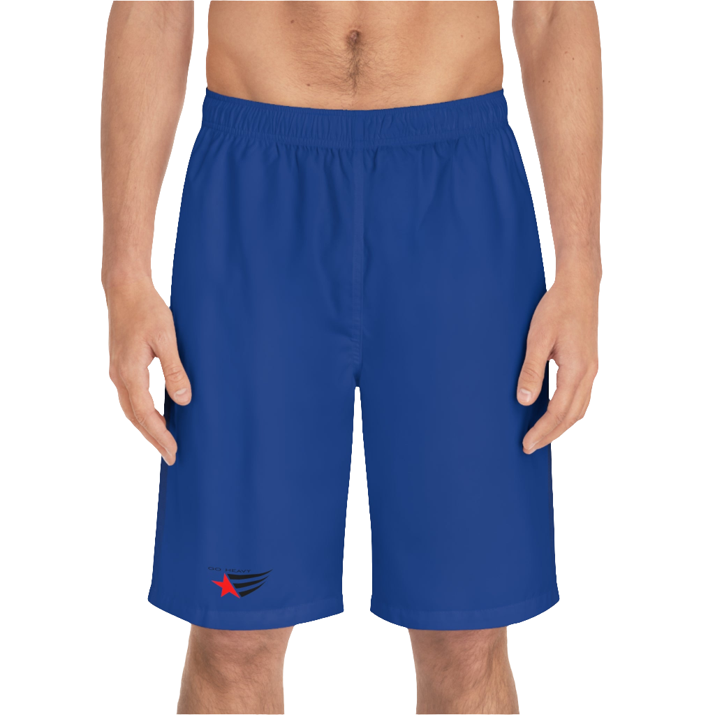 A man wearing pair of dark blue men's board shorts with a small Gymstar logo on the left leg front side view.