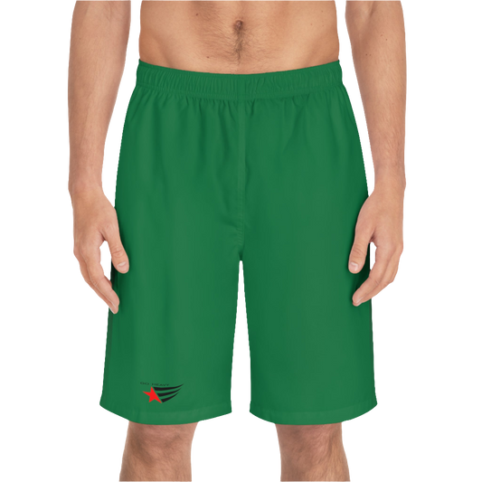 A man wearing pair of green men's board shorts with a small Gymstar logo on the left leg front side view.