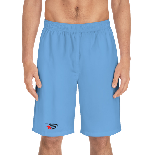 A man wearing pair of blue men's board shorts with a small Gymstar logo on the left leg front side view.