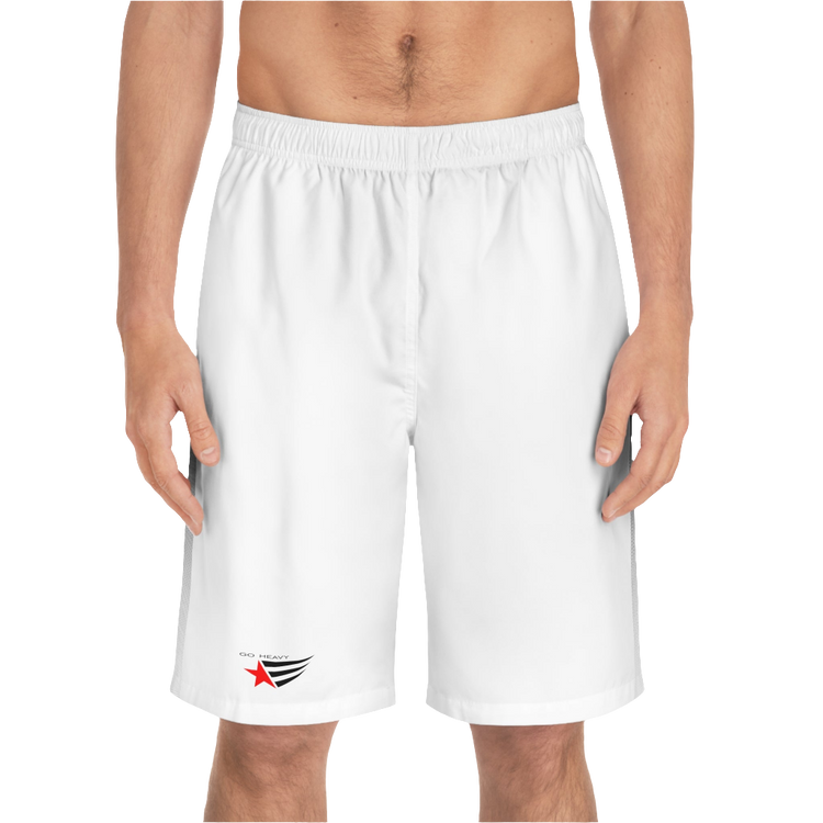 A man wearing pair of white men's board shorts with a small Gymstar logo on the left leg.