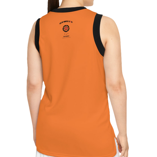 A woman with a fitness body is wearing an orange Gymstar sports tank top branded with the Gymstar Fit logo and a motivating print, back view.