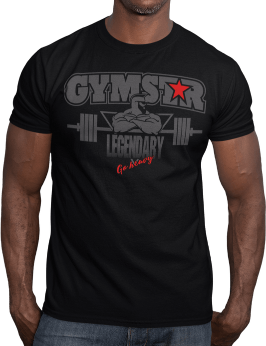 A man wearing black athletic T-shirt GYMSTAR with grey text and graphic on the front reading "LEGENDARY" featuring bodybuilder and barbell illustration, logo above.