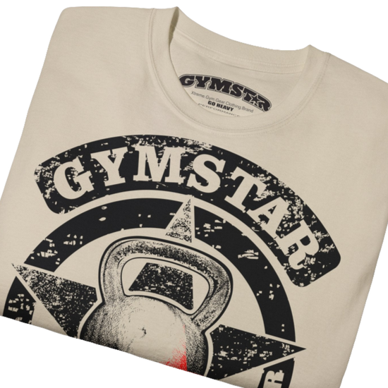 A  beige crop Gymstar tee with a red and black graphic that reads 'Get More Power' and has a big star and skull kettlebell, presumably bodybulding or fitness. close up view.