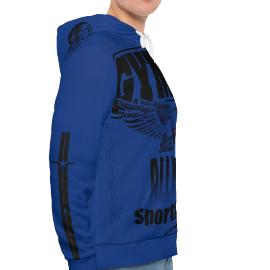 A man wearing a blue hoodie with 'GYMSRTA' and related graphics printed on the front, including a star and the text 'ALL WINNERS'. He has a casual and confident expression right cide view.
