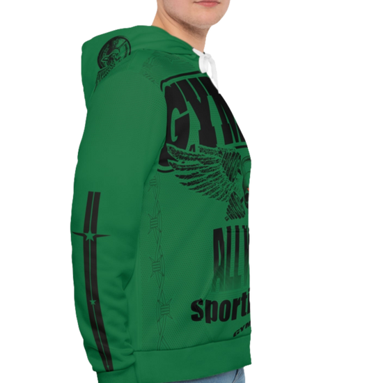 A man wearing a green hoodie with 'GYMSRTA' and related graphics printed on the front, including a star and the text 'ALL WINNERS'. He has a casual and confident expression right cide view.