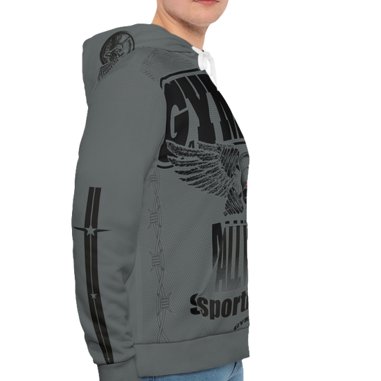 A man wearing a sports grey hoodie with 'GYMSRTA' and related graphics printed on the front, including a star and the text 'ALL WINNERS'. He has a casual and confident expression right cide view.