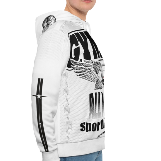 A man wearing a white hoodie with 'GYMSRTA' and related graphics printed on the front, including a star and the text 'ALL WINNERS'. He has a casual and confident expression right cide view.