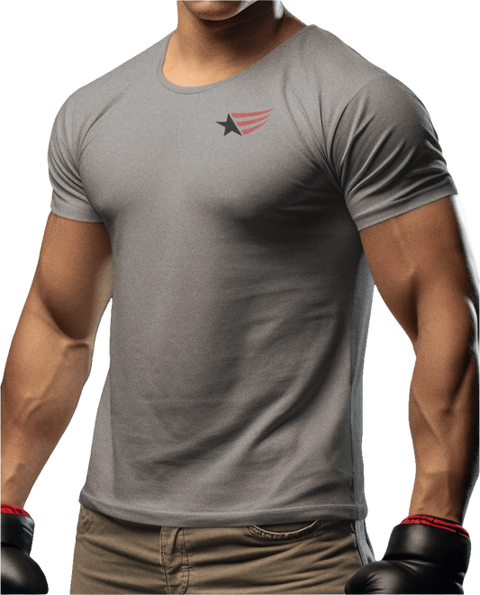 A men's gray short-sleeved t-shirt Gymstar designed for fitness. It features a small logo on the left chest, which consists of a black star and three red stripes. The model is also wearing brown pants and black gloves.