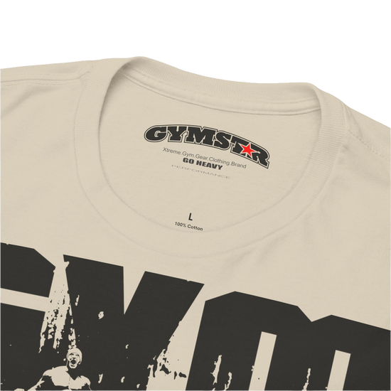 A beige Gymstar workout tee with a black graphic that reads 'GYM',  bodybuilder silhouettte and logo, presumably bodybulding or fitness.  Logo Close up view.