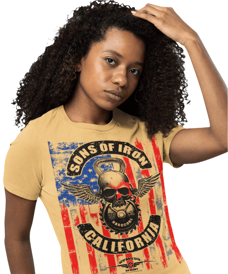 A woman wearing black Gymstar tee with a red, blue and black graphic that reads 'Sons Of Iron', skull-kettlebell, barbell and logo, presumably bodybulding or fitness. 